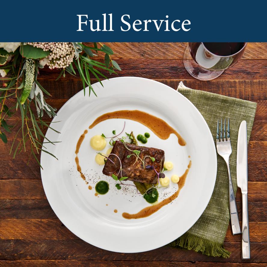 Full Service Catering image with beef tenderloin  plated meal artfully arranged